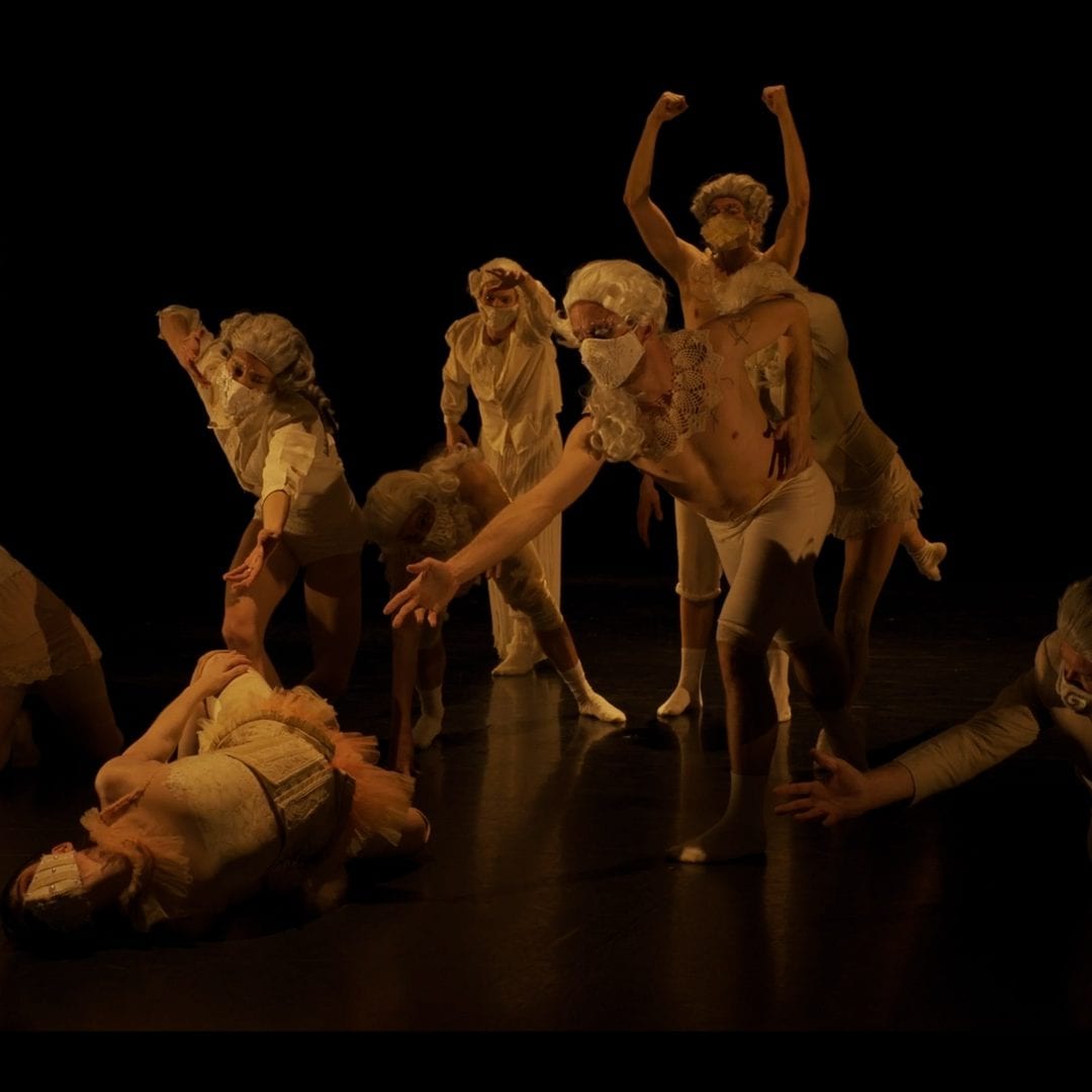 Screenshot of studio showing of Orfeo ed Euridice featuring dancers in costume, wigs and masks while performing in the Faris Family Studio