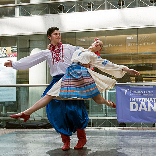 Dancers perform in the lobby of the Vancouver Public Library for International Dance Day