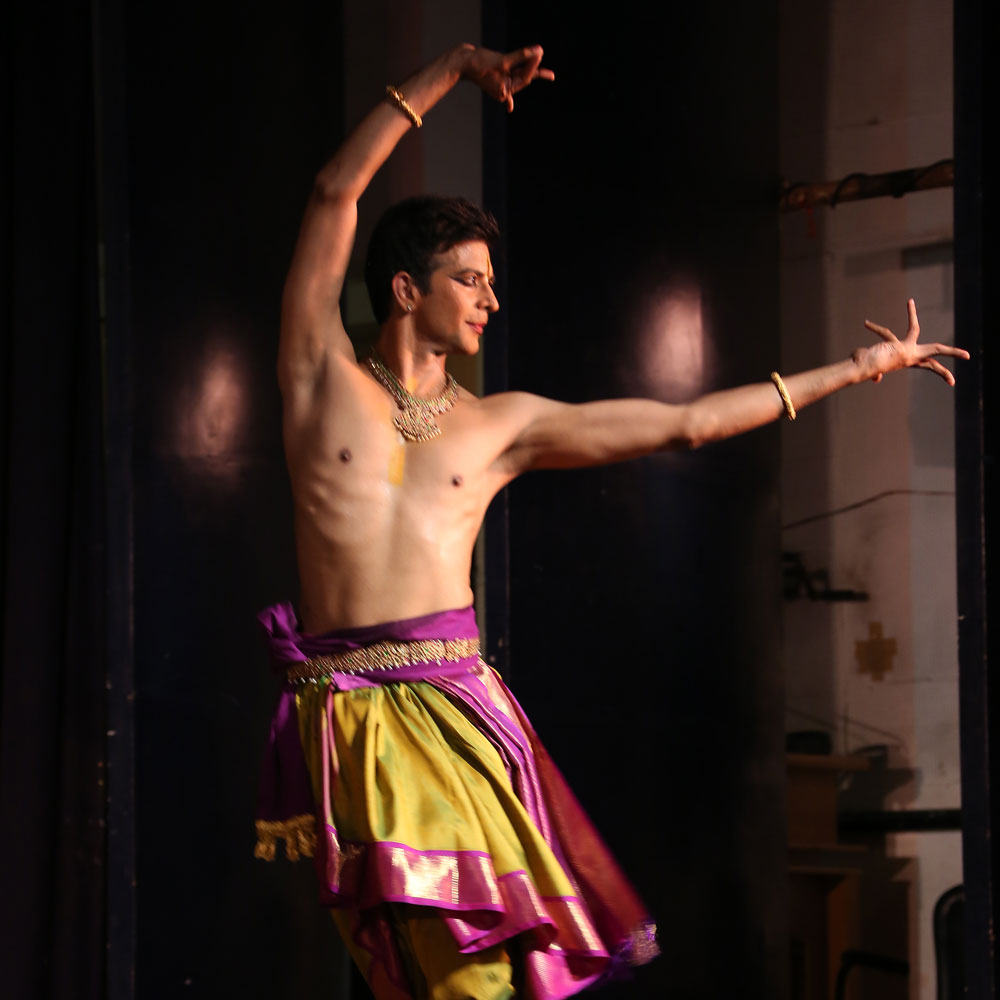 Dance artist Sujit Vaidya poses mid performance