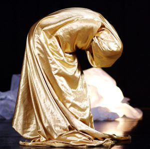 Zahra Shahab in performance with gold fabric wrapped around her
