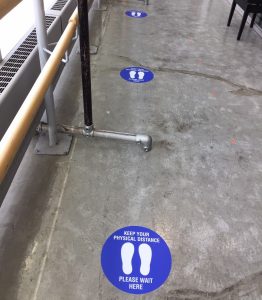 Physical Distancing decals placed 2m apart in the hallways at Scotiabank Dance Centre